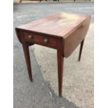 A nineteenth century mahogany pembroke table, the rectangular top with two rule-jointed rounded drop