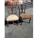 A late Victorian carved mahogany saloon chair with pierced leaf carved splat beneath shell carved