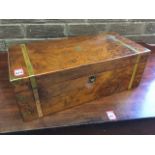 A Victorian walnut writing slope having brass military style mounts, the box with fitted interior