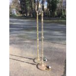 A pair of brass standard lamps with baluster columns on circular bases. (59in) (2)