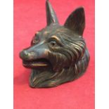 A German style carved wood inkwell with inlaid glass eyes, modelled as a fox with hinged head