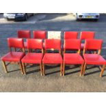 A set of ten 1930s mahogany dining chairs with rectangular backs above studded upholstered seats,