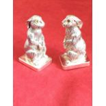 A pair of silver plated hare salt & pepper pots, the animals alertly seated on rectangular