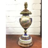 A Sêvres style tablelamp decorated with battle scene cartouche and river landscape on blue ground,