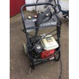 A German Universal Kraft 2500PSI pressure washer with petrol engine on trolley stand. (A/F)