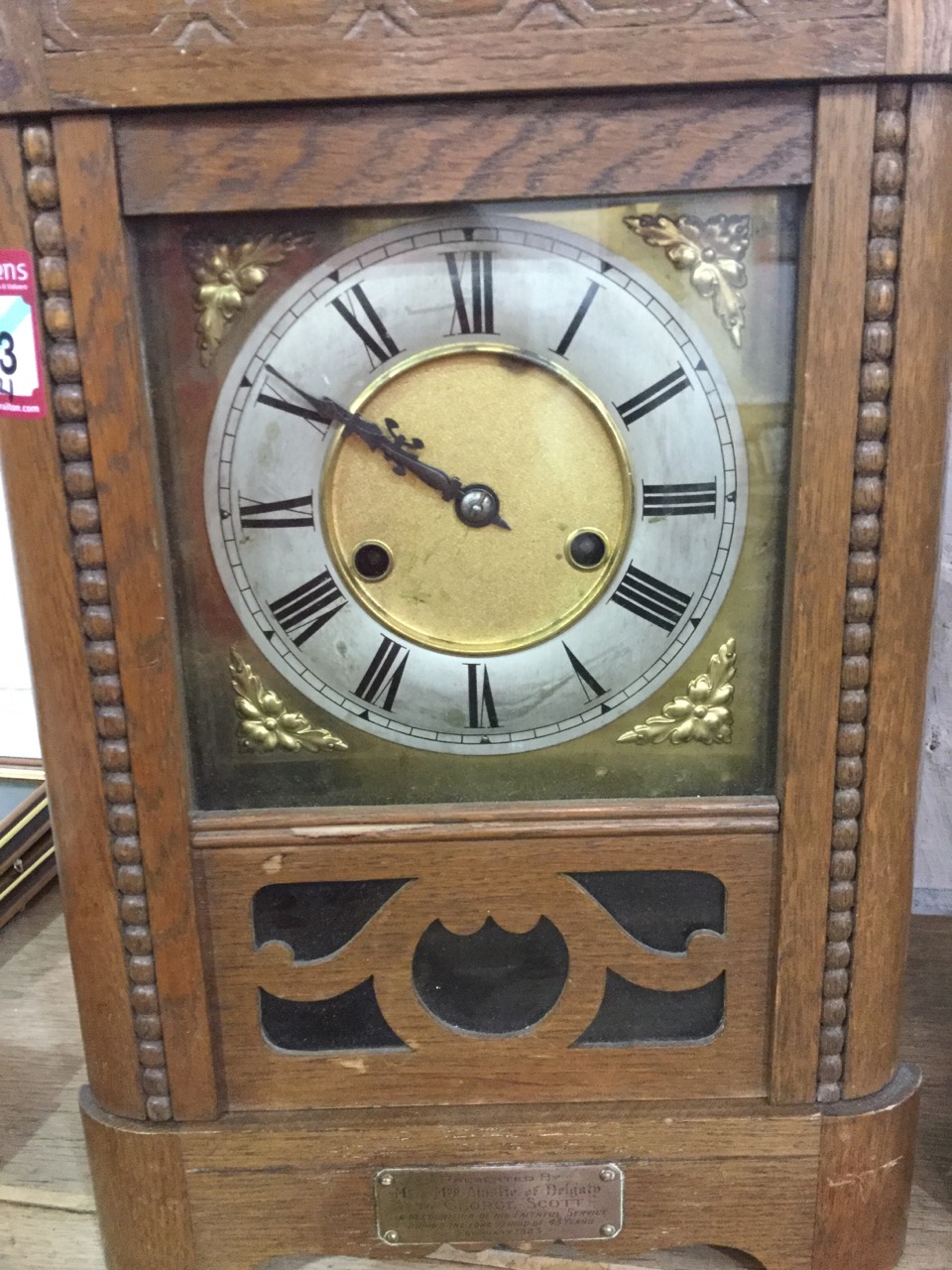 A 1923 presented oak cased mantleclock, the rounded case with bead decoration having brass dial with - Image 3 of 3