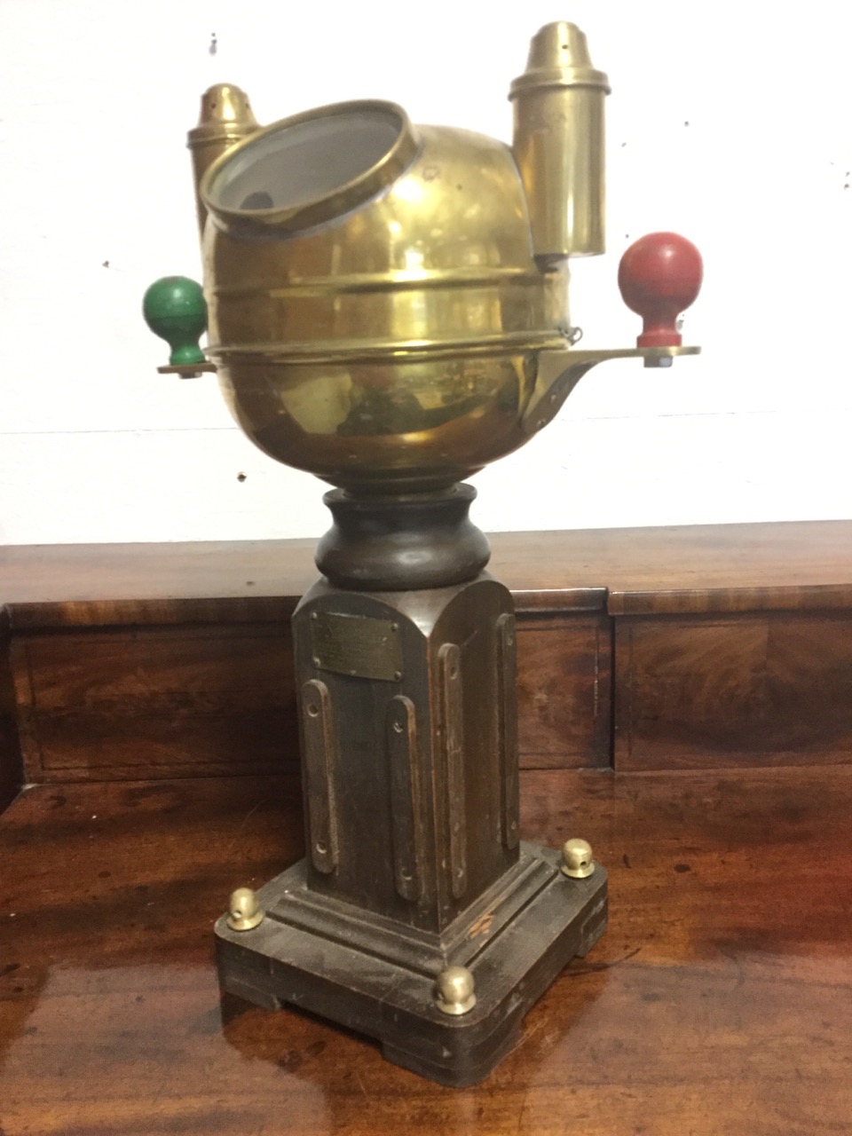 A Sestrel brass ships binnacle by Henry Browne & Son, mounted on square column stand, the domed