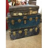 Two similar school type trunks with studded edges and metal & brassed mounts; and an old Edwardian