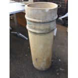 A tubular stoneware chimney pot moulded with two ring bands. (33in)