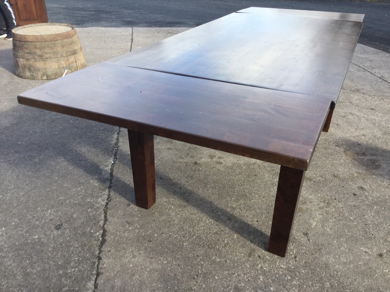 A rectangular hardwood dining table with two spare leaves, raised on square column legs. (95in x - Image 2 of 3