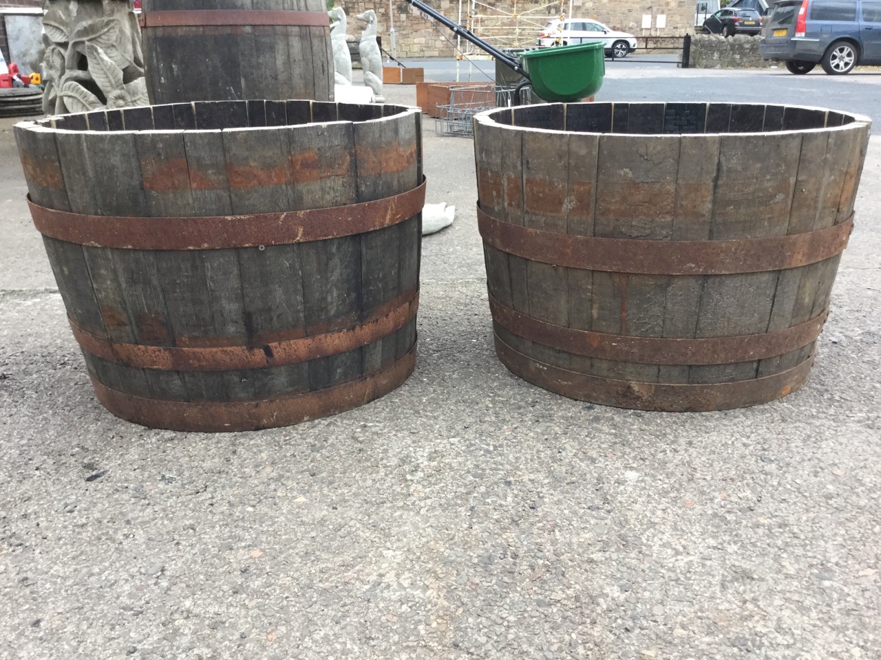 A pair of oak garden barrel tubs, each with staves bound by three riveted metal strap bands. (17in x - Image 3 of 3