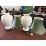 A pair of large ivory crackle-glazed tablelamps of ginger jar form on verdigris metal stands, with