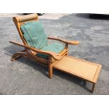 A hardwood plantation chair, the adjustable ratchet supported back with roller headrest having loose