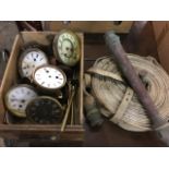 A box of old clock parts - dials, springs, covers, brass rods, etc; and a canvas fire hose with
