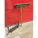 A Victorian brass lecturn stand having angled pierced bookrest with scrolled supports on tubular