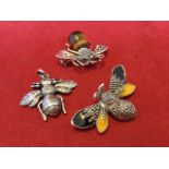 A 925 silver bee brooch with tigers eye thorax and inlaid ruby eyes; another silver hallmarked bug