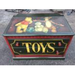 A painted childs chest with shaped upstand above a rectangular moulded top and ribbed frieze, having