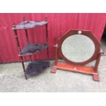 A stained pine dressing table mirror with octagonal frame and circular plate on moulded supports;