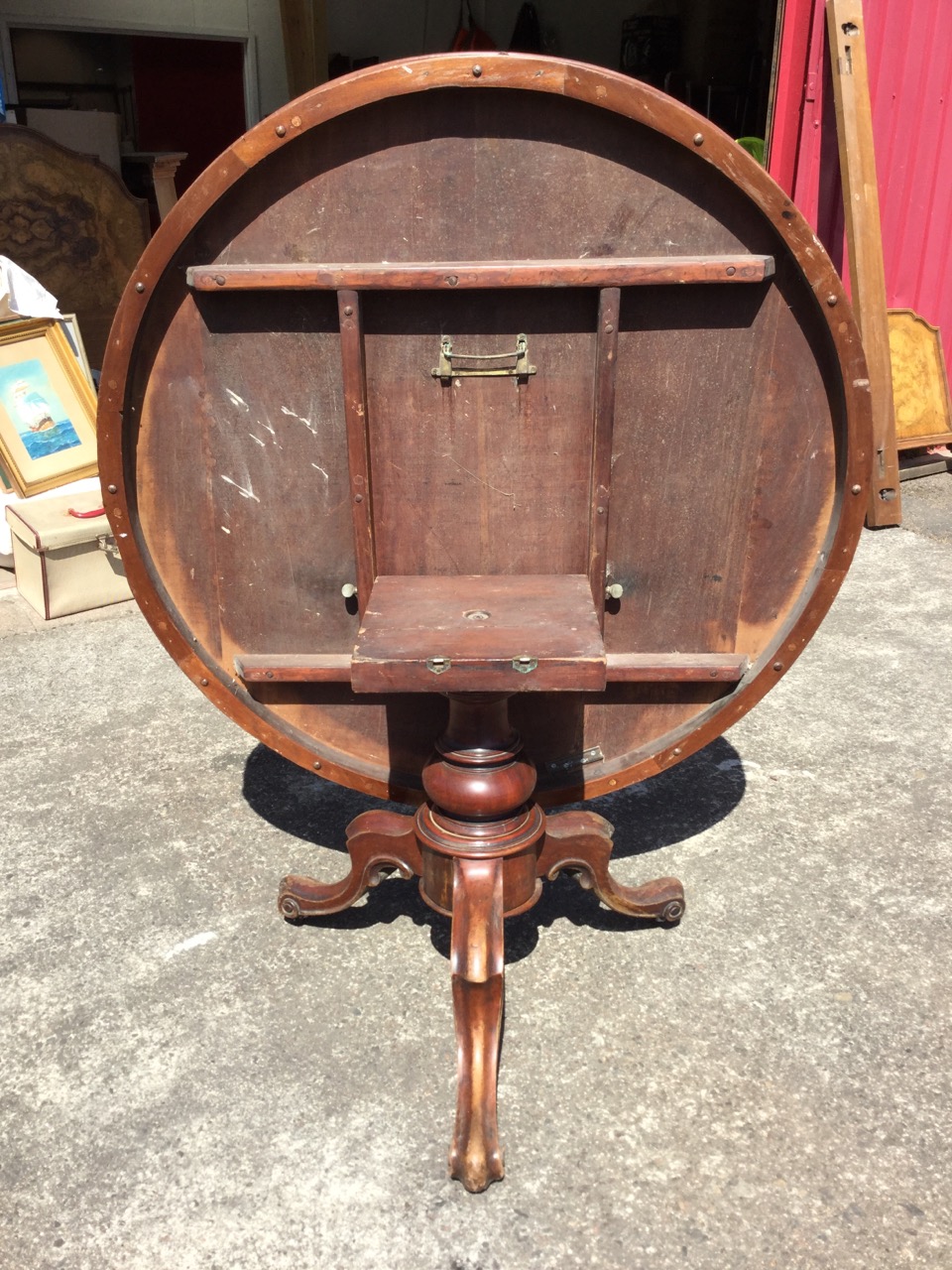 A circular Victorian mahogany breakfast table, the moulded top with plain frieze supported on a