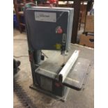 A Redeye 250W electric bandsaw with 12in cutting table, guide, adjustable angle, etc.