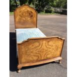 A 3ft Edwardian walnut bed with arched crossbanded headboard & tailboard in moulded frames having