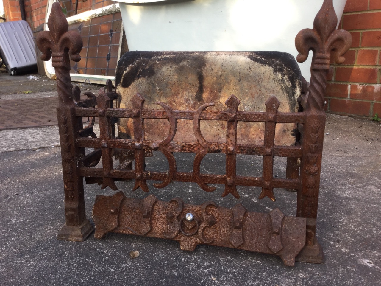 A rectangular wrought iron dog grate, having firebrick back and riveted trellis framed basket, the - Image 3 of 3