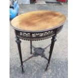 An oval Adams style Edwardian mahogany occasional table, the moulded top above an anthemion fretwork