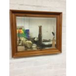 A contemporary rectangular mirror with bevelled plate in moulded pine frame. (24.5in x 20.5in)
