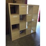 A modern rectangular wall cabinet with eight cupboards & eight pigeonholes. (58in x 15.5in x 57.
