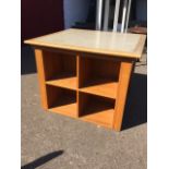 A contemporary square marble topped table, the slab in moulded frame, having two sides with four