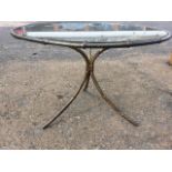 A circular gilded metal glass topped coffee table, with ring and three waisted legs cast as bamboo