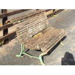 A garden bench with wood slatted curved back & seat on channelled metal shaped frame. (47in)