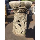 A large carved stone birdbath, with circular bowl on pierced tapering stand, both pieces with