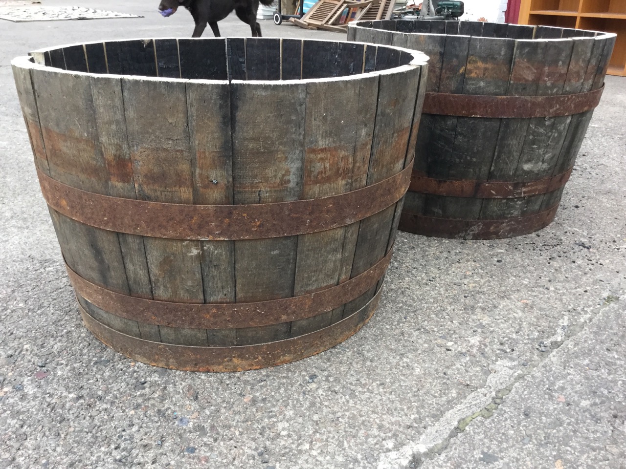 A pair of oak garden barrel tubs, each with staves bound by three riveted metal strap bands. (17in x - Image 2 of 3