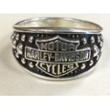 A gentlemans silver signet type ring with Harley-Davidson embossed to beaded panel - 925 marks. (