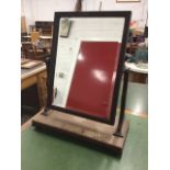 A Victorian mahogany dressing table mirror, the bevelled plate in moulded frame on shaped channelled