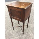 A nineteenth century mahogany bedside nightstand, with panelled door to cupboard raised on turned