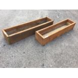 A pair of rectangular wood plant troughs, the planters made up from 1.25in scaffolding boards. (50.