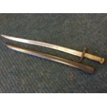 A nineteenth century French Chassepot sword bayonet with scabbard, the channelled steel blade