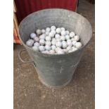 A galvanised dustbin full of 494 golf balls. (494)