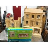 A childs wood dolls house of kit form, never fully constructed and some still boxed with