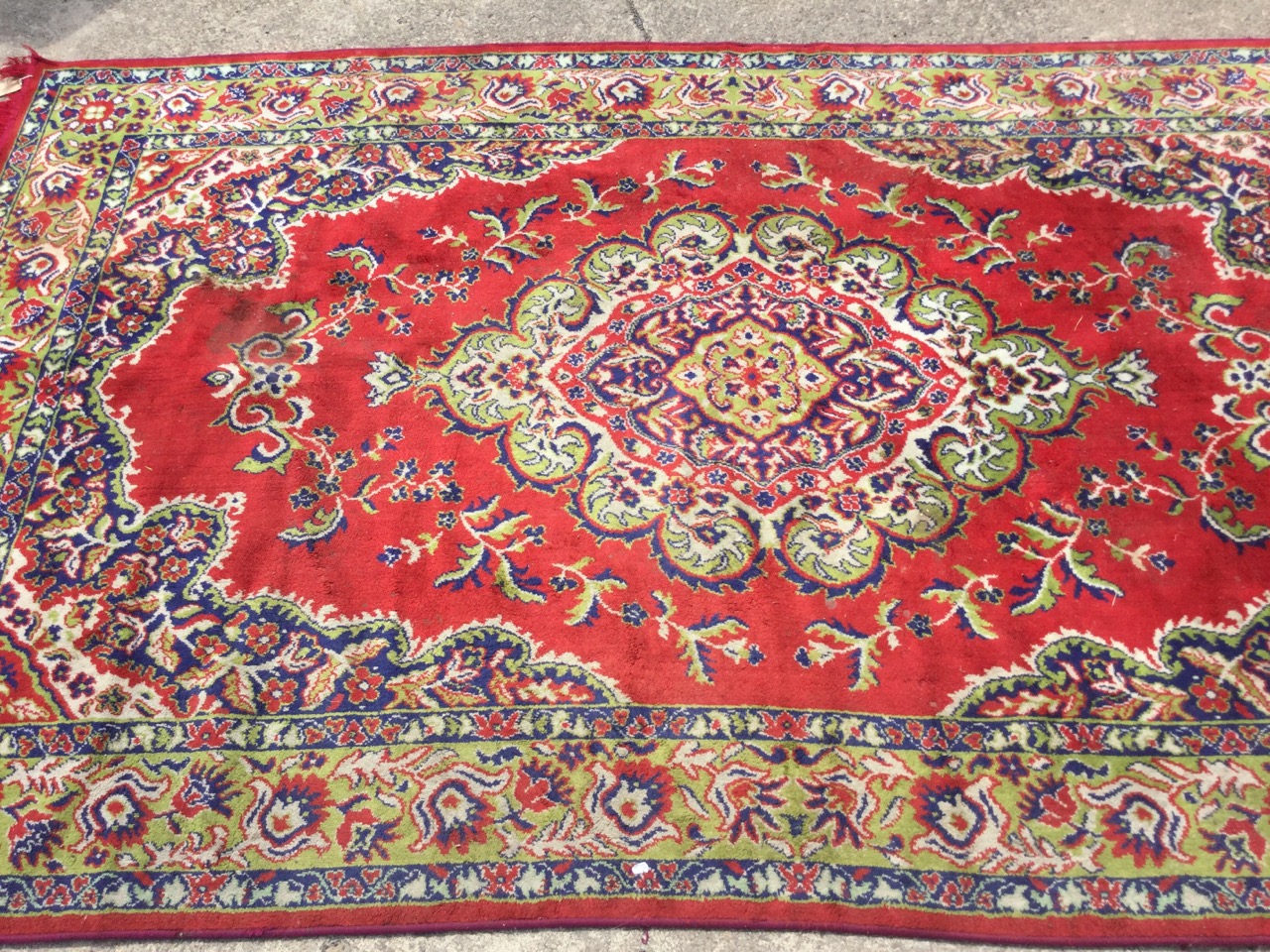 An oriental style rug woven with oval scalloped floral medallion in red field framed by conforming - Image 3 of 3
