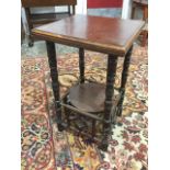 A square mahogany occasional table with moulded top on ring-turned column legs joined by circular