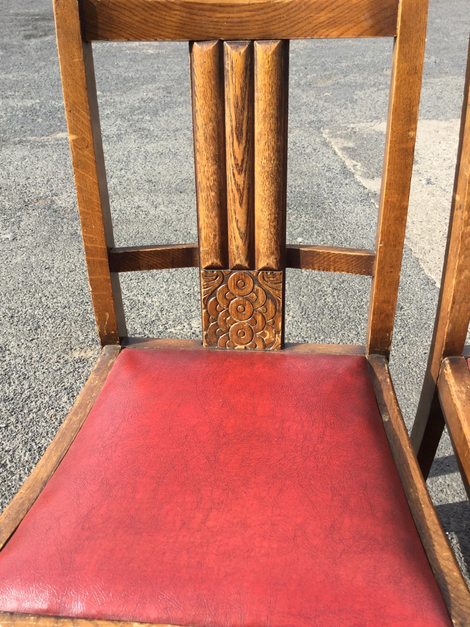 A pair of 1930s oak chairs with fluted splats above stylised carved roundel panels, the drop-in - Image 3 of 3