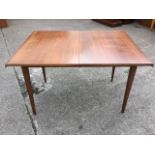A Meredew teak draw-leaf dining table, with integral spare leaf, raised on square tapering column