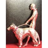 A deco style sterling silver brooch modelled as a flapper lady with hound, the dogs collar set