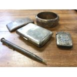Five pieces of hallmarked silver - a curved card case, an hexagonal propelling pencil, a two-piece