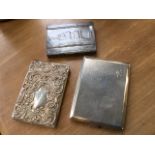 A Victorian hallmarked silver card case embossed with scrolling - Birmingham; a rectangular hammered