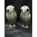 A pair of silver plated cruets models as owls with unscrewing heads, the salt & pepper pots having