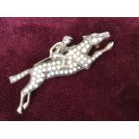 A 9ct gold jockey brooch, pave set with opals and diamonds, having hinged pin to verso. (1.75in)